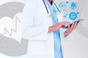 Image of doctor reviewing tablet 300x200